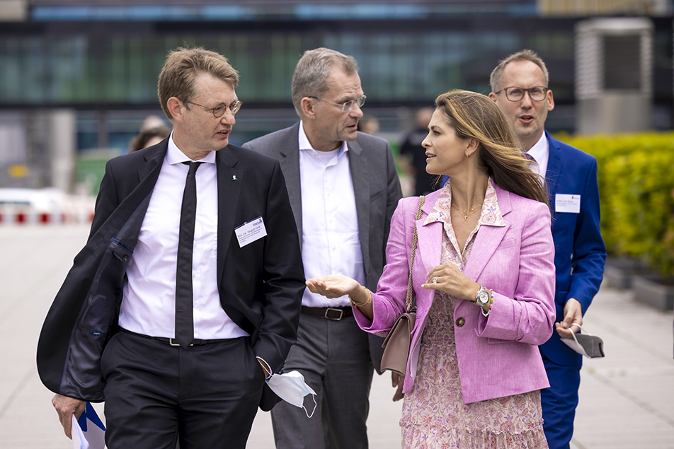 Princess Madeleine speaks with Professor Jürgen Graf, Ministry for Social Affairs and Integration Kai Klose, and Honorary Consul Christian Bloth during a tour of the site where the Child Advocacy Centre will be built in Frankfurt. 