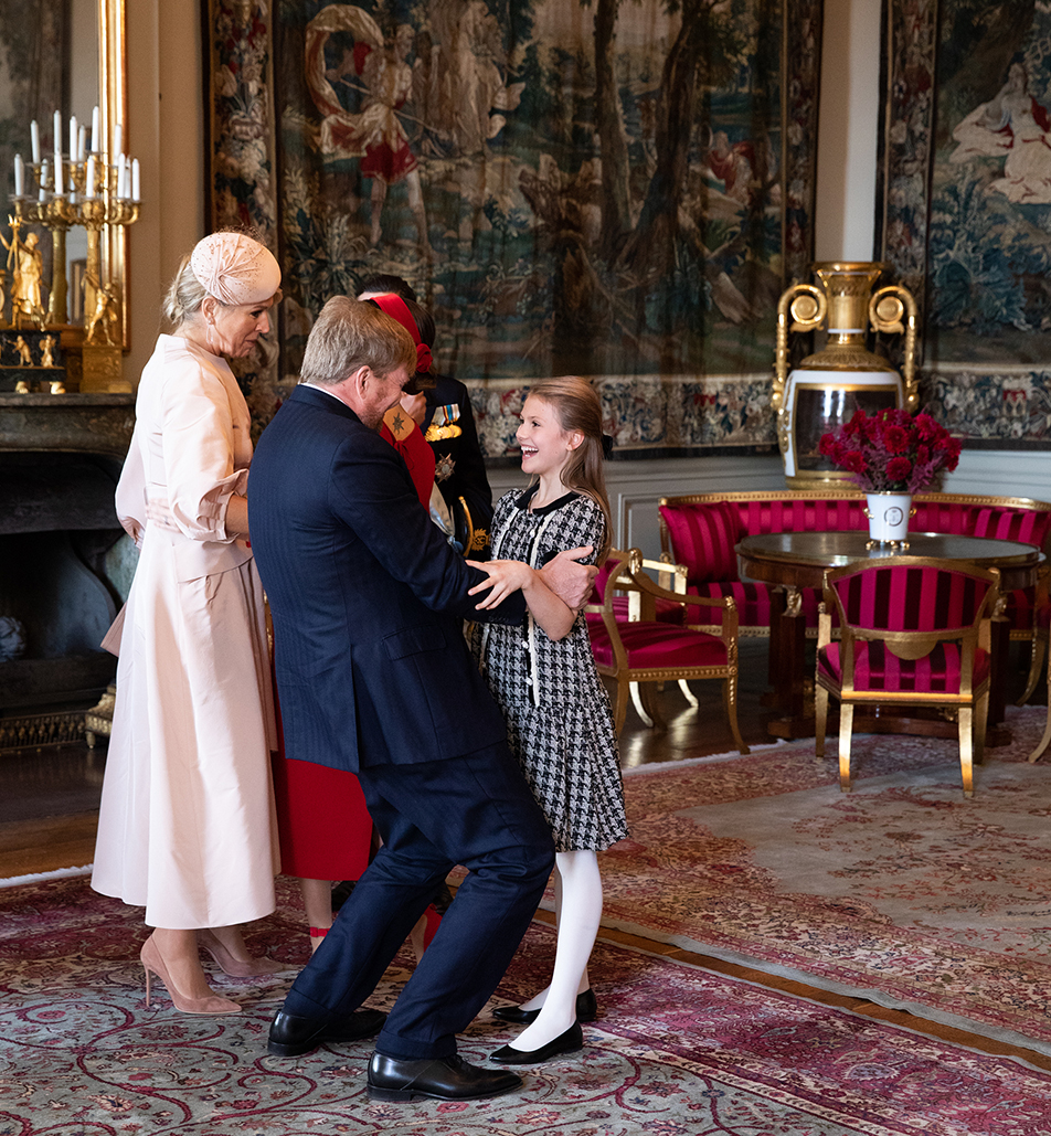 Princess Estelle greets her godfather, the King of the Netherlands. 
