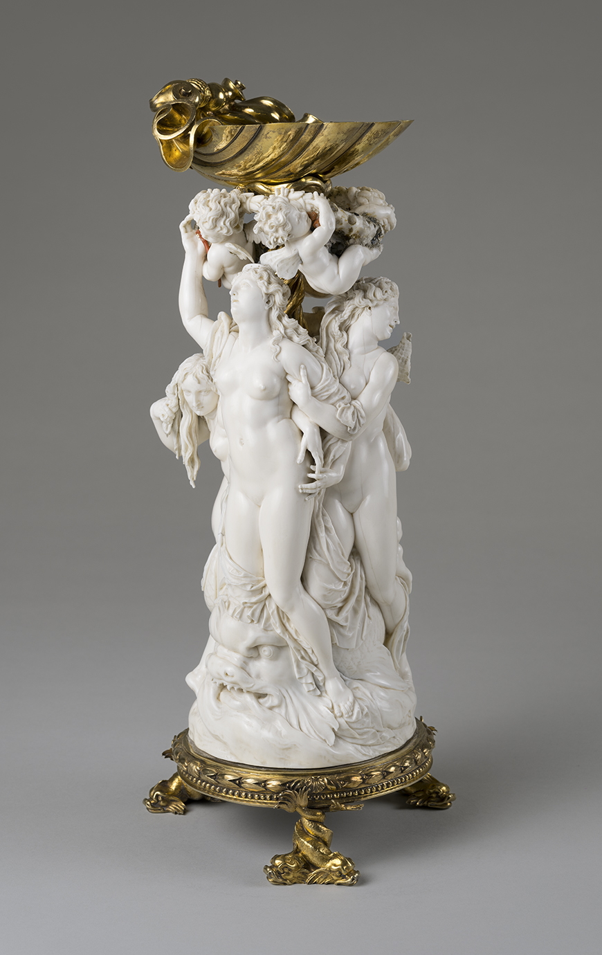 Ivory salt cellar, the triumph of Venus, the foot and the shell in gilt silver.