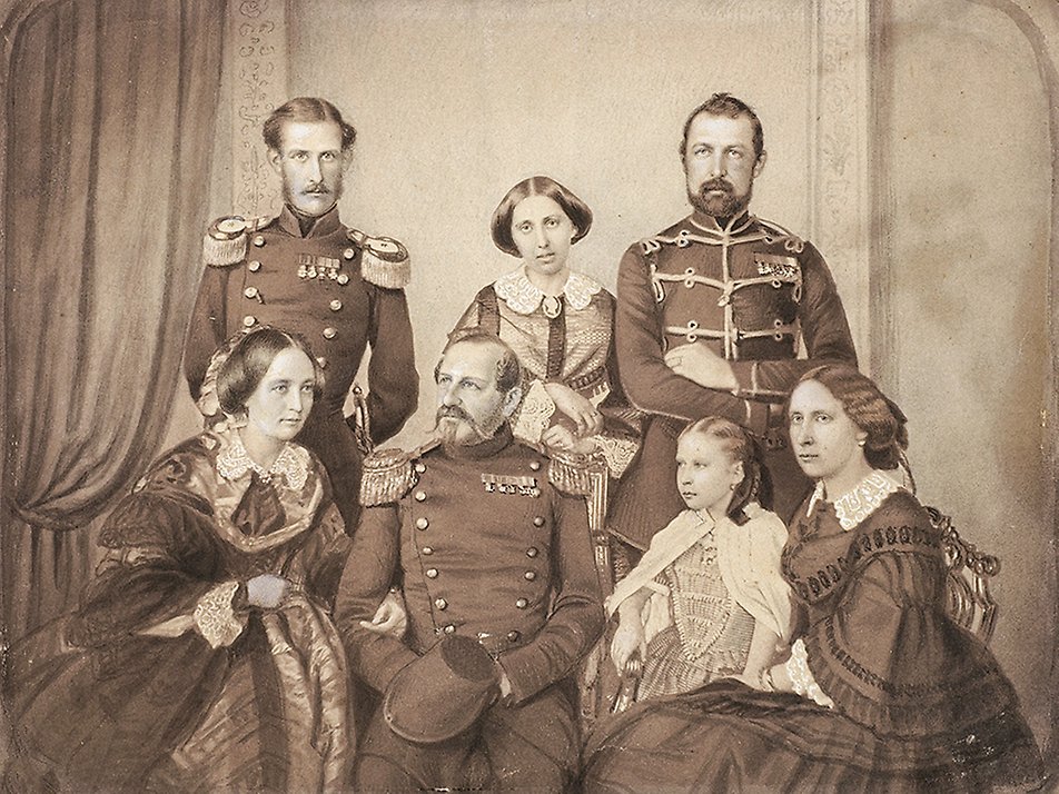Portrait of King Oskar I and his family, circa 1856. Top row, from left: Prince August, Princess Eugénie and Crown Prince Karl (XV). Bottom row, from left: Queen Josefina, King Oskar I, Princess Louise and Crown Princess Lovisa. This is the oldest known photograph to include a Swedish queen, and was taken by Mathias Hansen. 